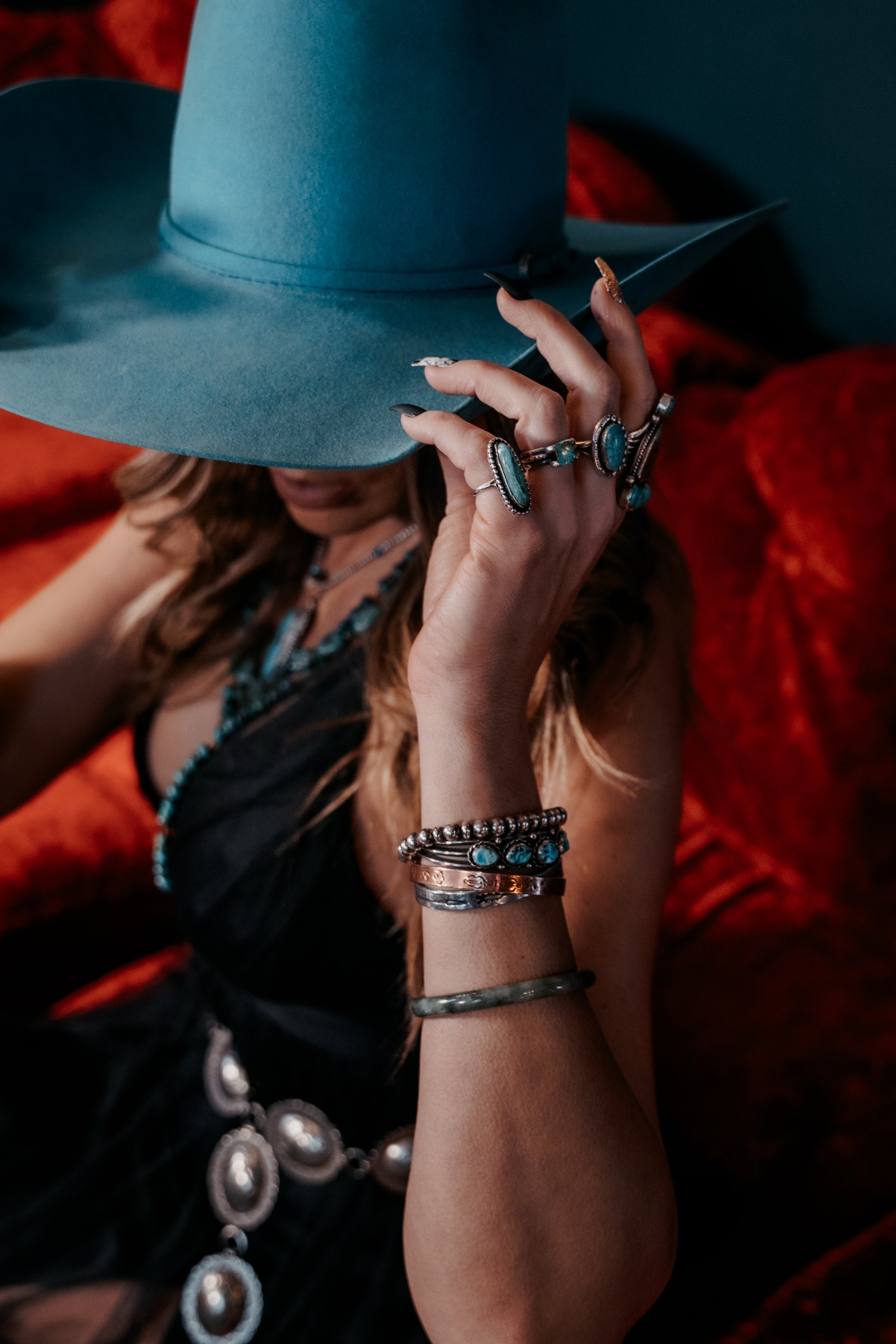 Load video: Video showcasing turquoise worn by models dressed in modern western fashion clothing